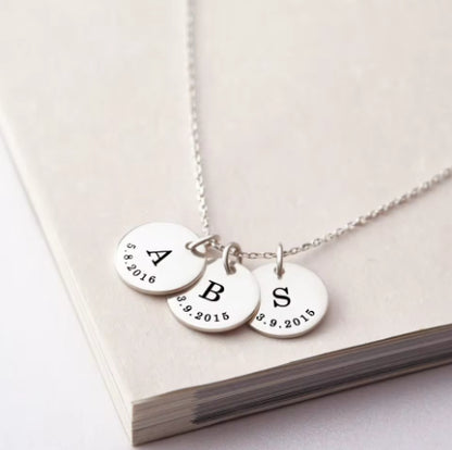 A Rusted Steel Engraved Round Plate Necklace With A Personalized Pet Head Engraving