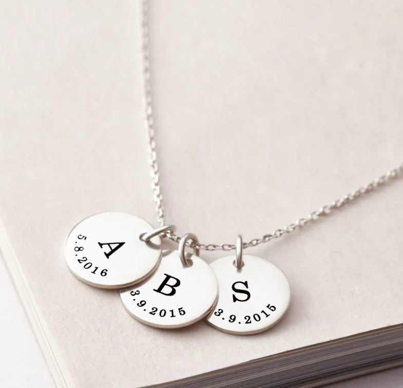 A Rusted Steel Engraved Round Plate Necklace With A Personalized Pet Head Engraving